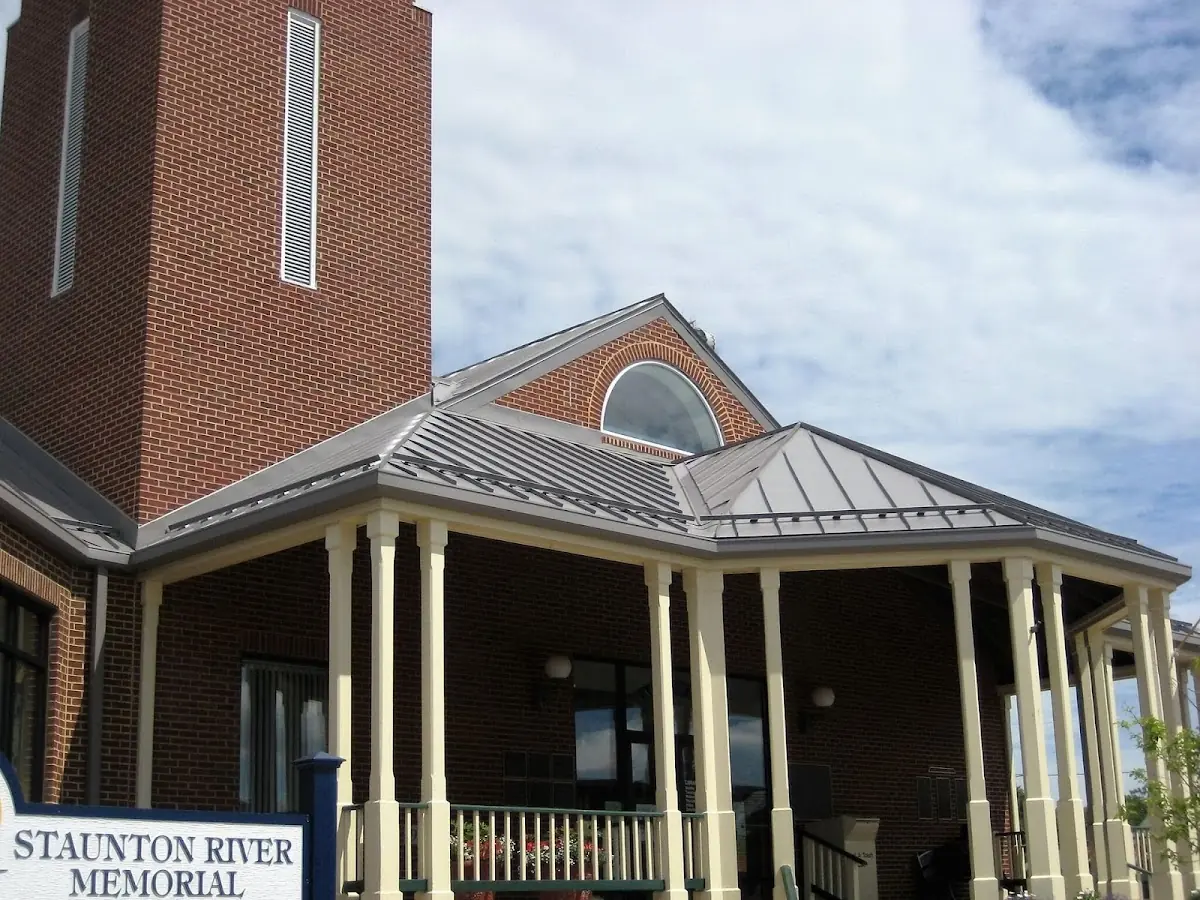 Skilled roofing craftsmen working on a residential roof in Hurley